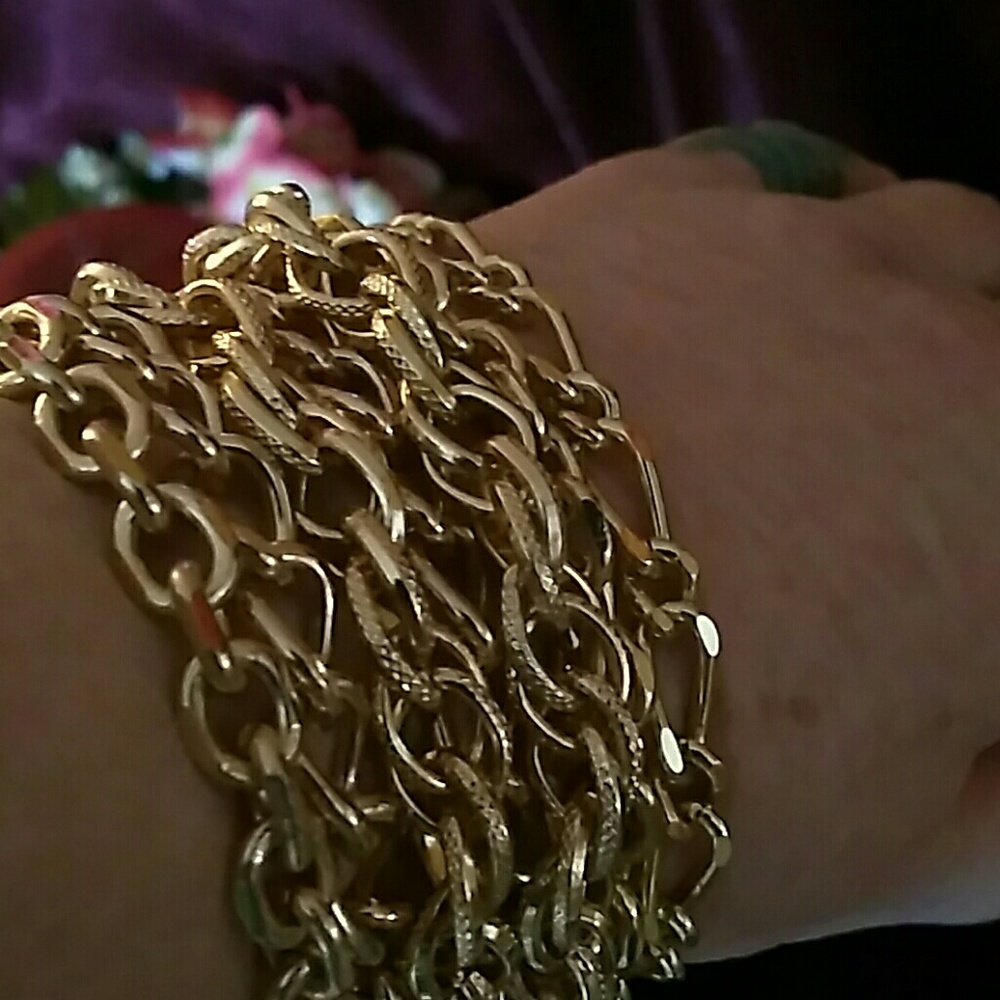 Gold tone chain bracelet with magnetic clasp.